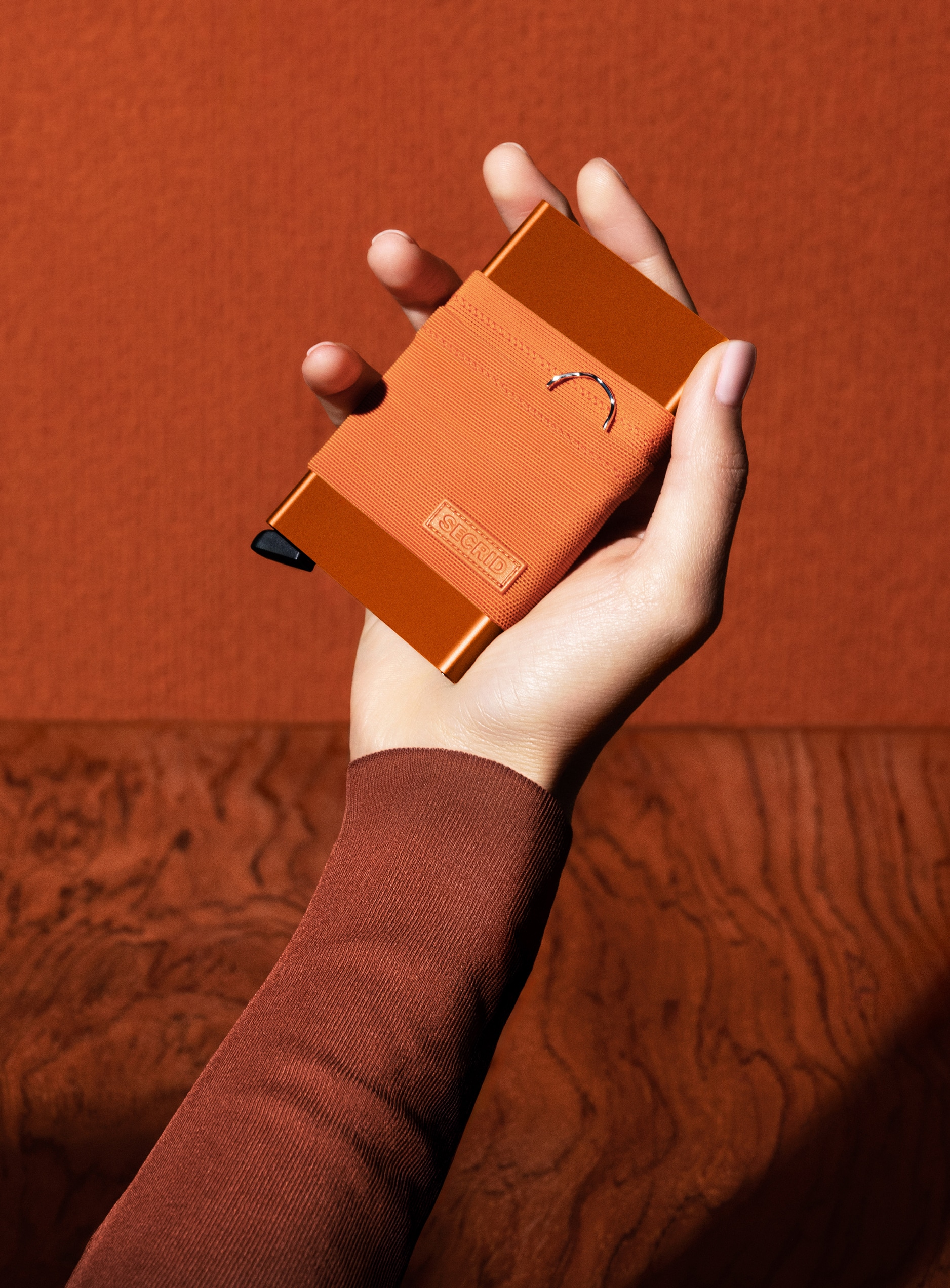 Real life image of the flexwallet-orange wallet