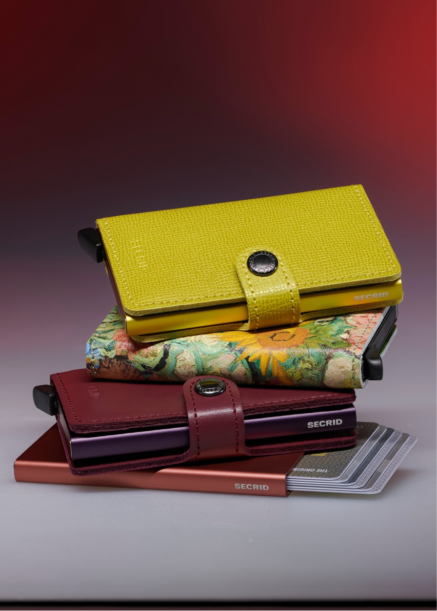 Four colourful Secrid wallets