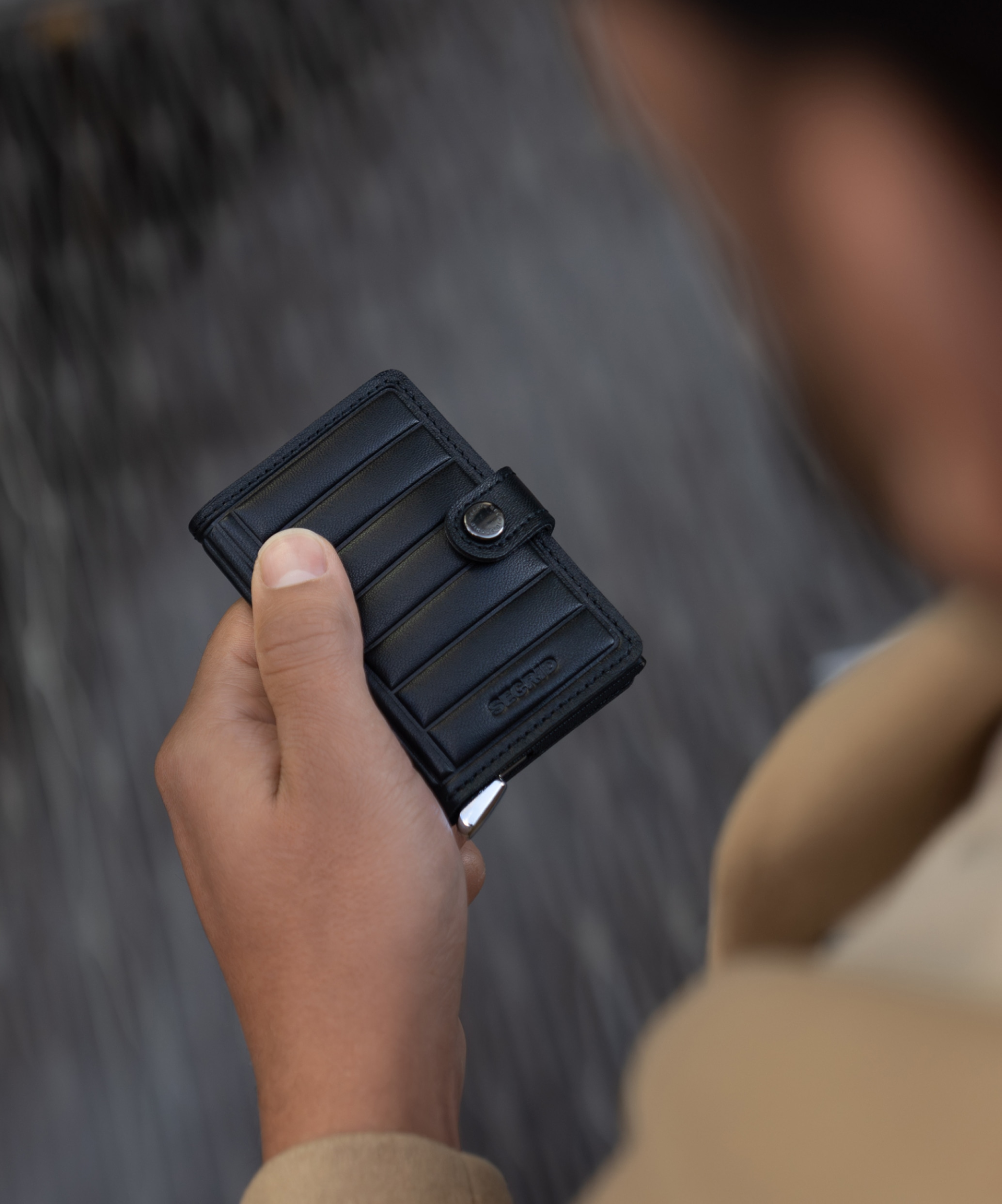 Real life image of the premium-miniwallet-emboss-lines-black-- wallet