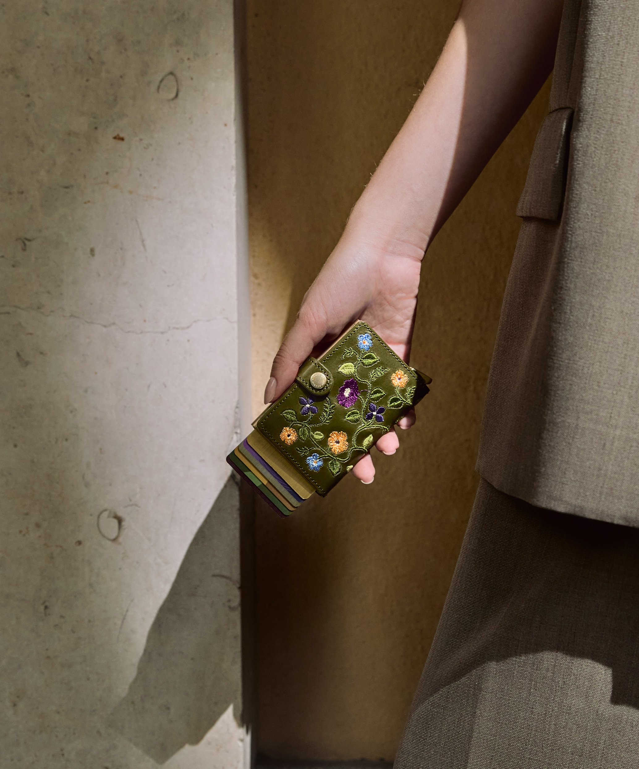 Real life image of the premium-miniwallet-stitch-floral-olive-- wallet