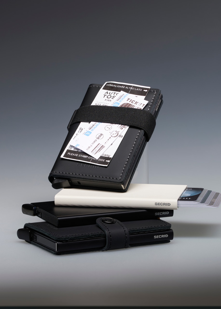 Stack of card holders, showcasing how metro card fits under the band